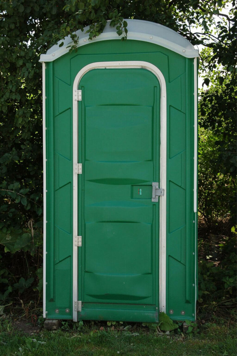 Green Porta Potty in The Woods