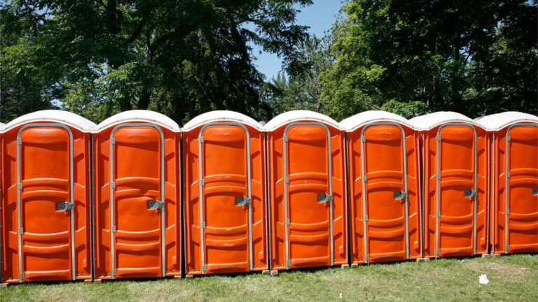 Row of Orange Porta Potties